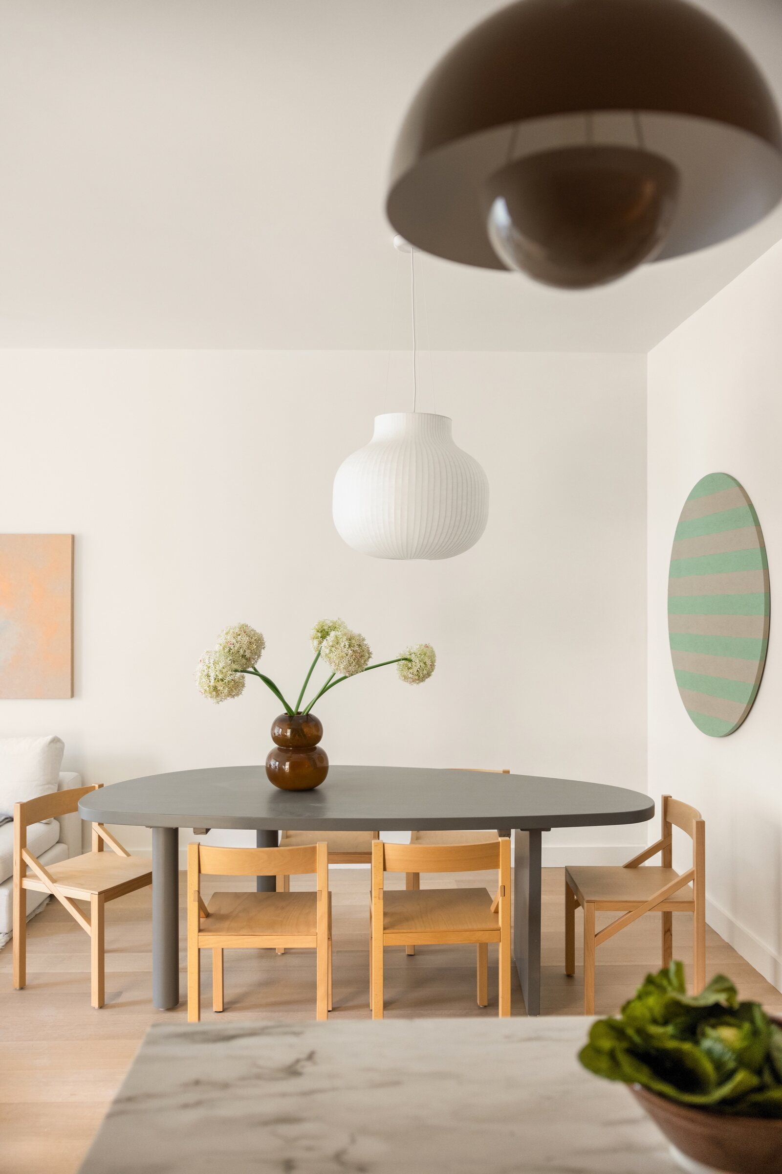 Dining room with sculptural lighting at 34 Garfield Place