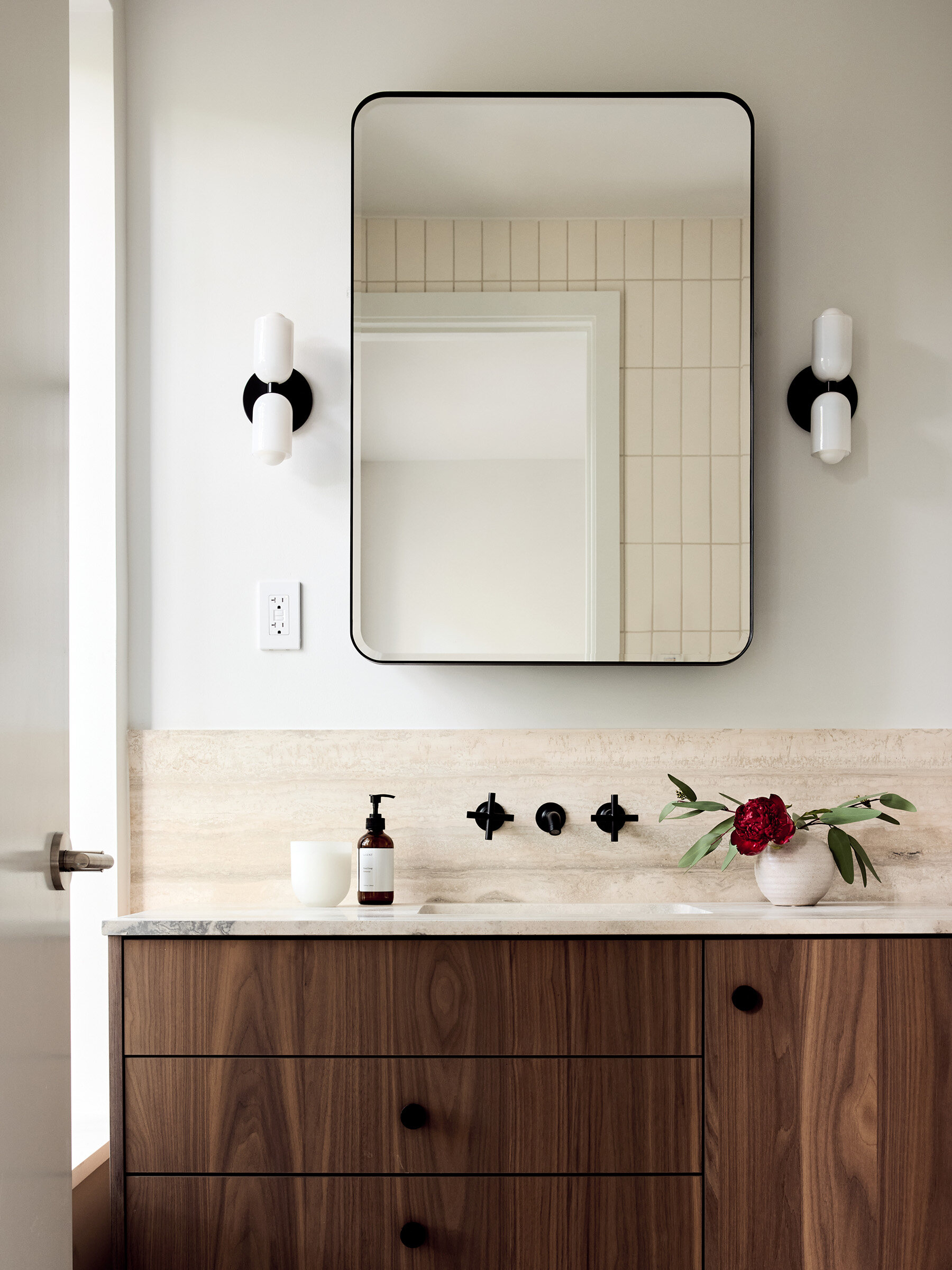 Walnut bathroom vanity and tiled wall at 42 Garfield Place