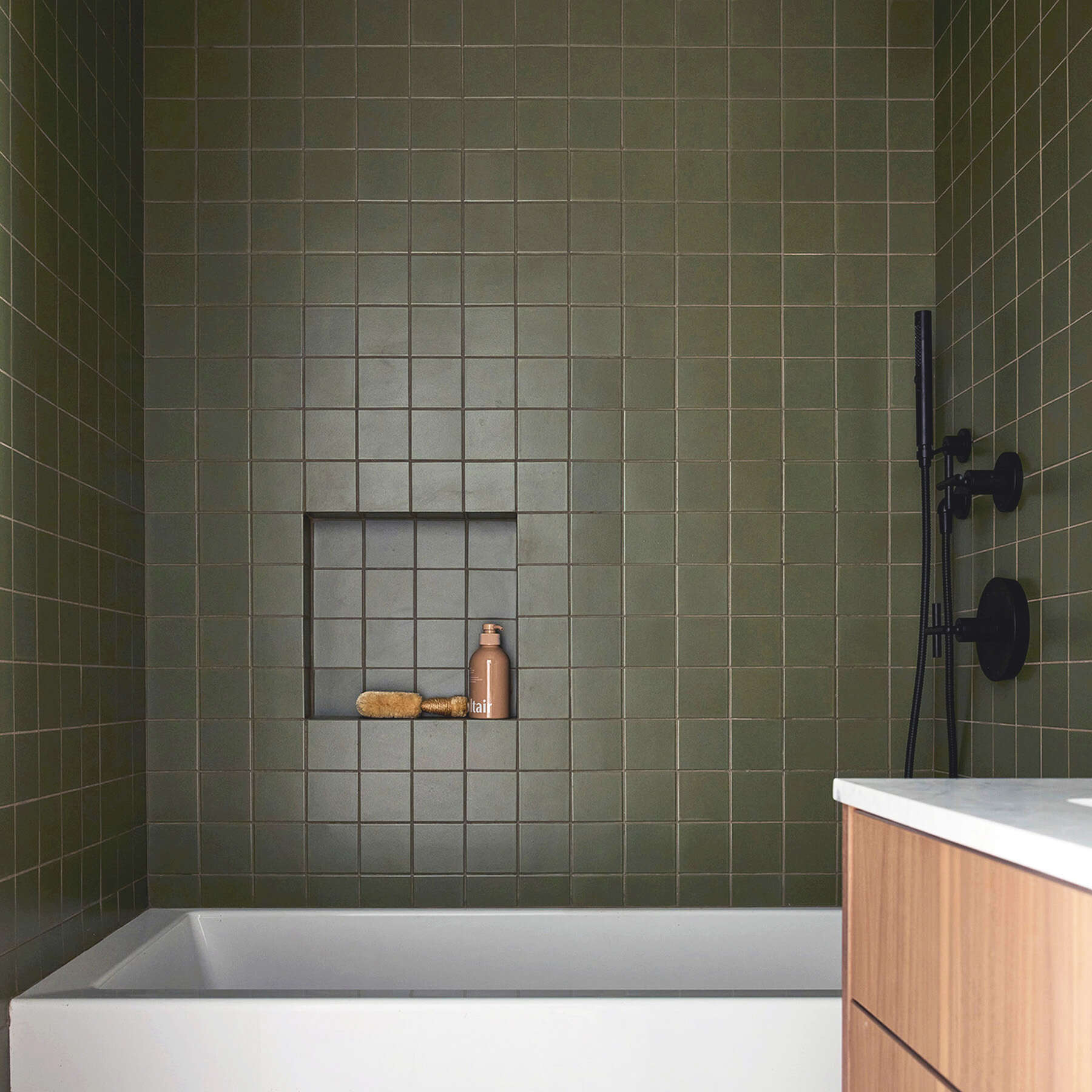 Green-tiled shower and built-in bench at 42 Garfield Place
