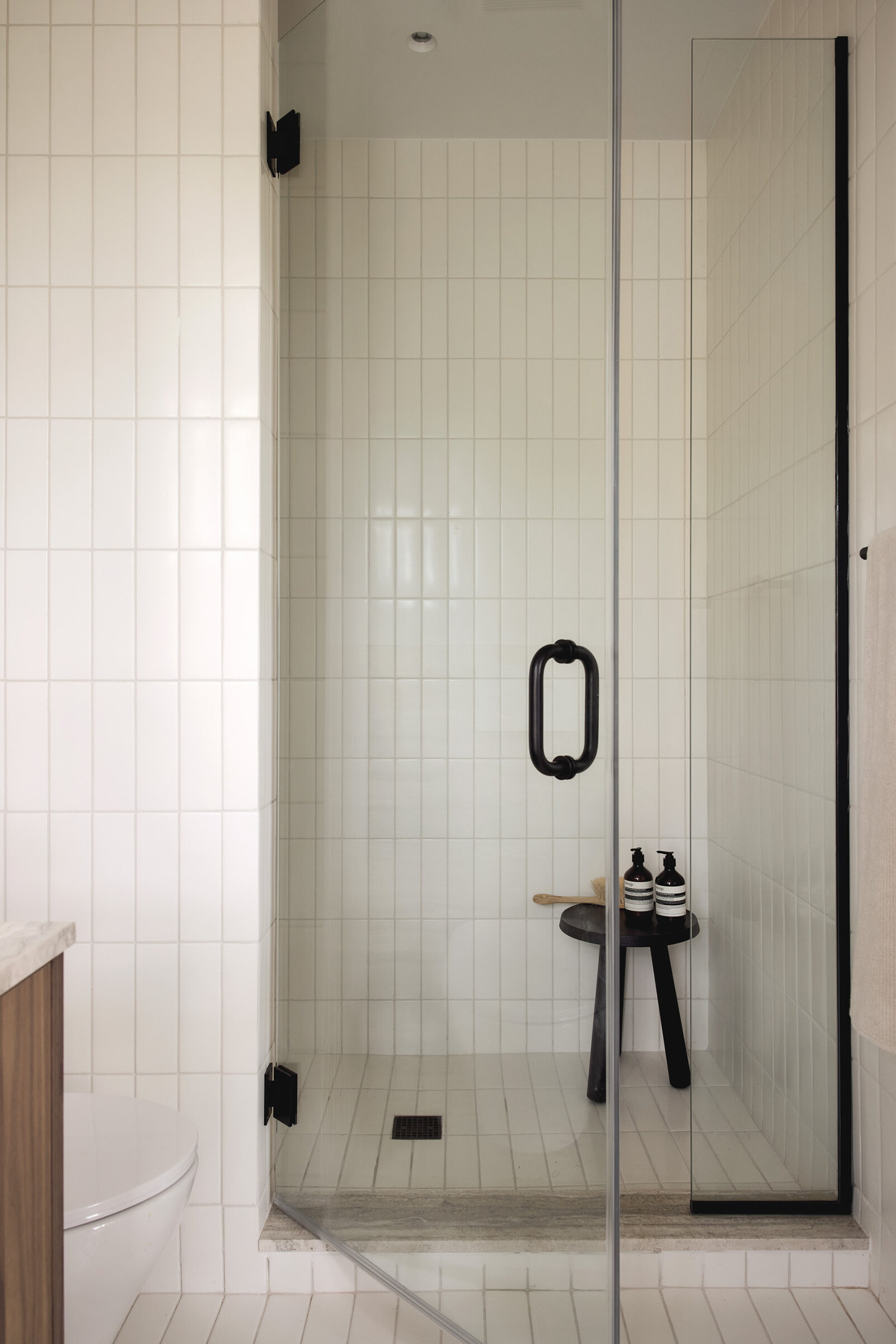 Glass-enclosed tiled shower at 42 Garfield Place