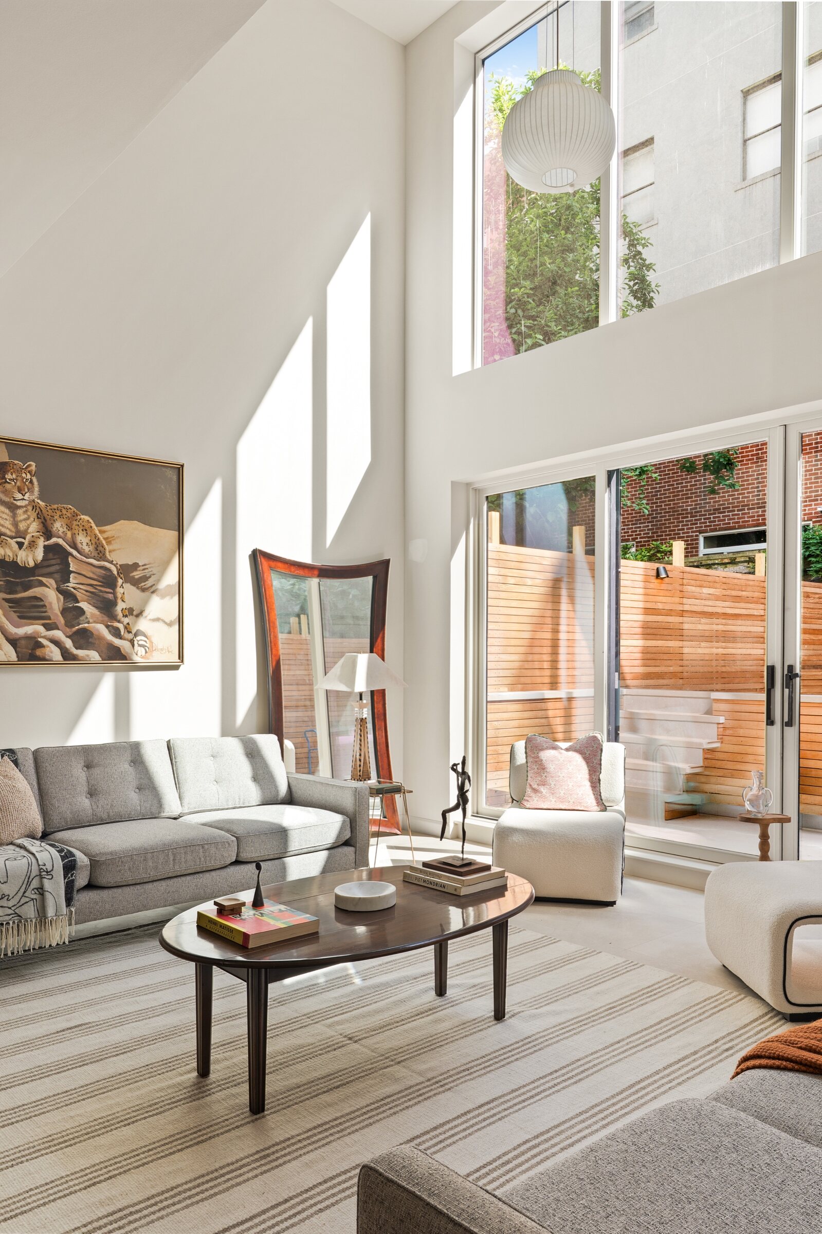 Double-height living room opening to the garden at 436 State Street