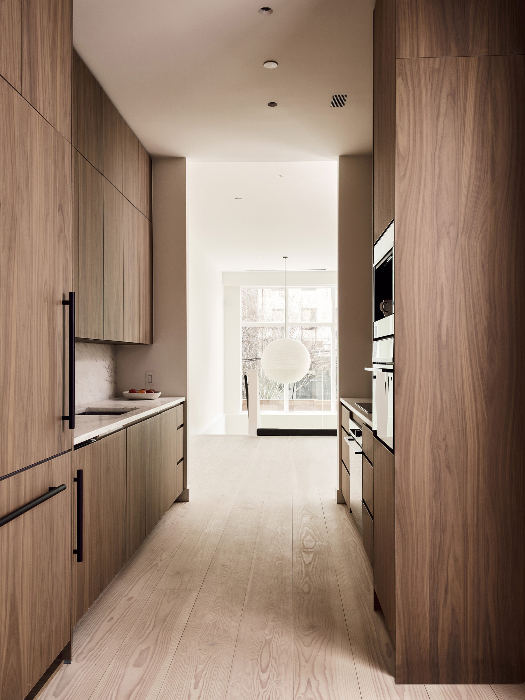Galley kitchen with walnut cabinetry at 44 Garfield Place