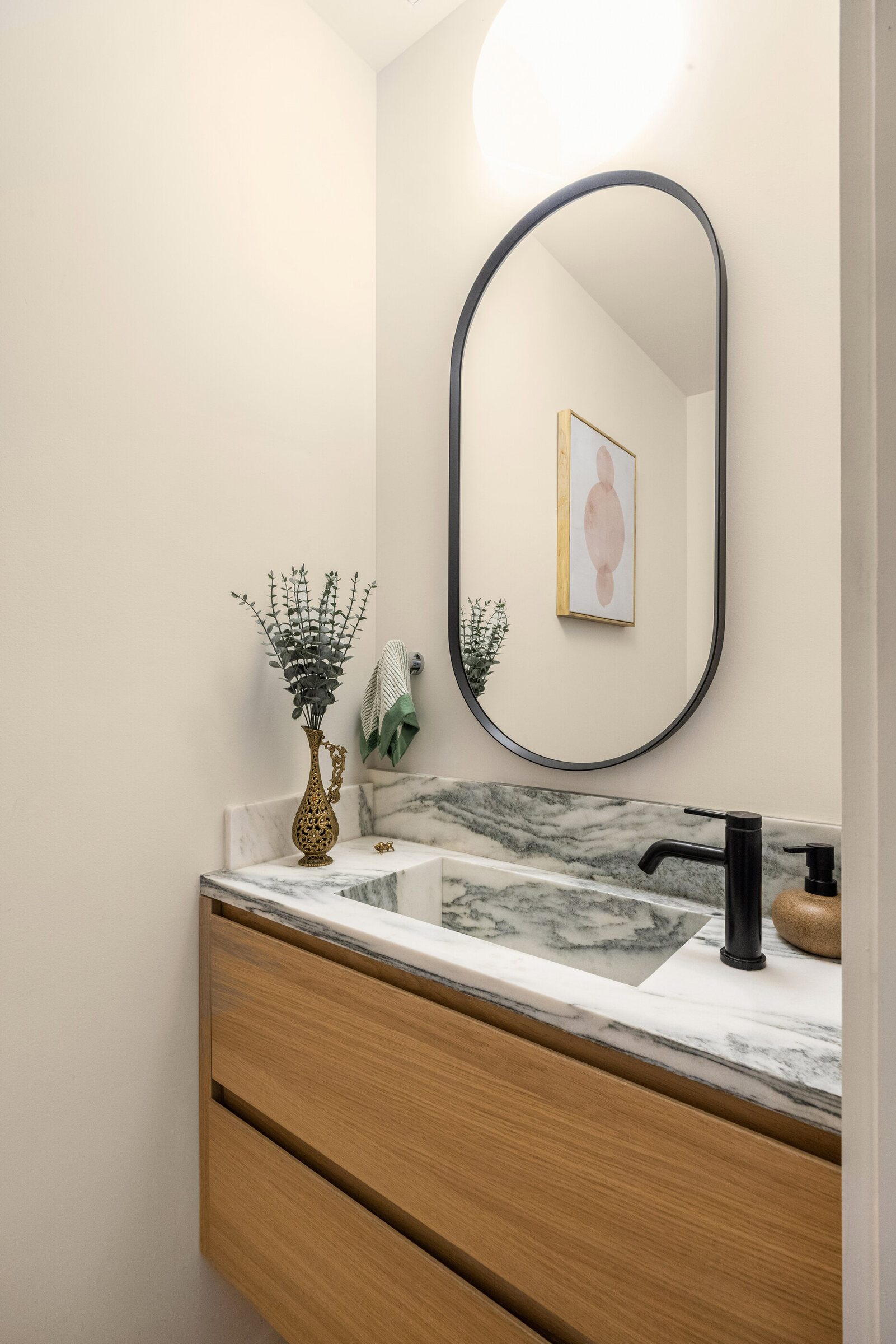 Oak and marble bathroom vanity at 591 10th Street