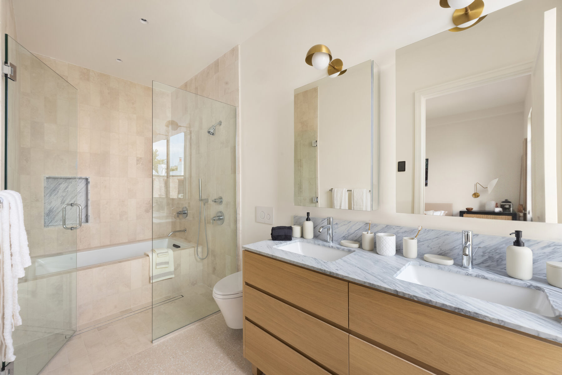 Primary bathroom with oak double vanity at 591 10th Street